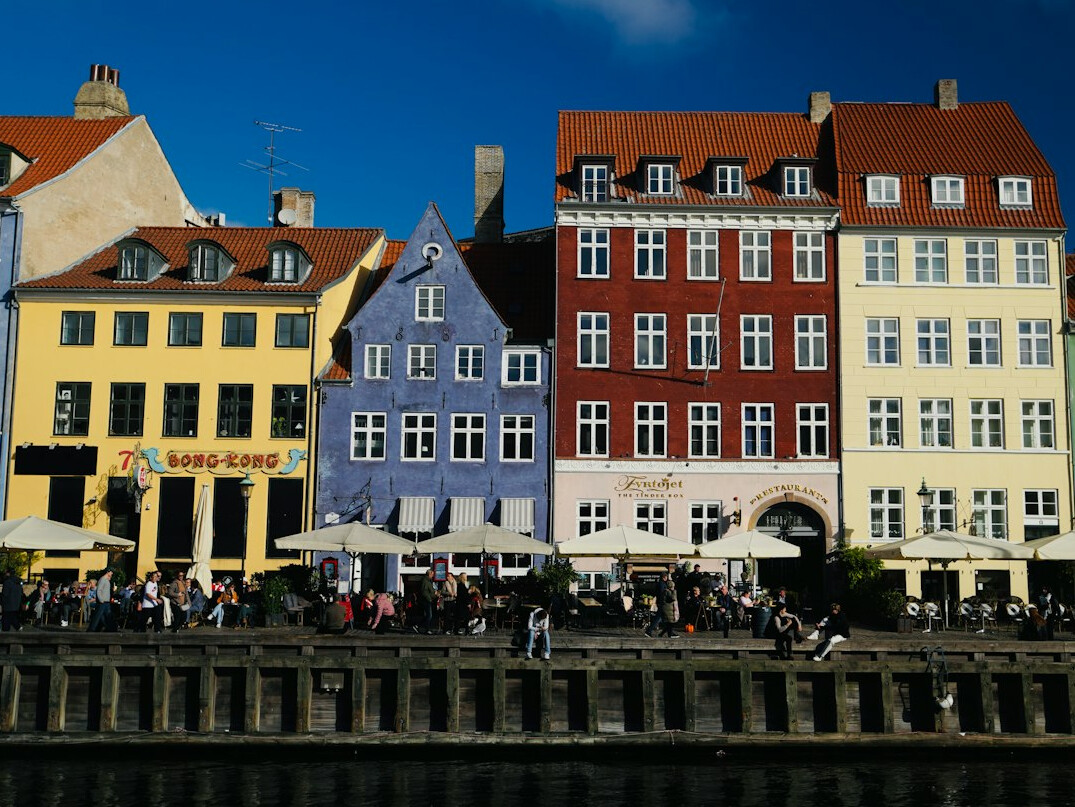 Colorful historic townhouses along a Copenhagen canal