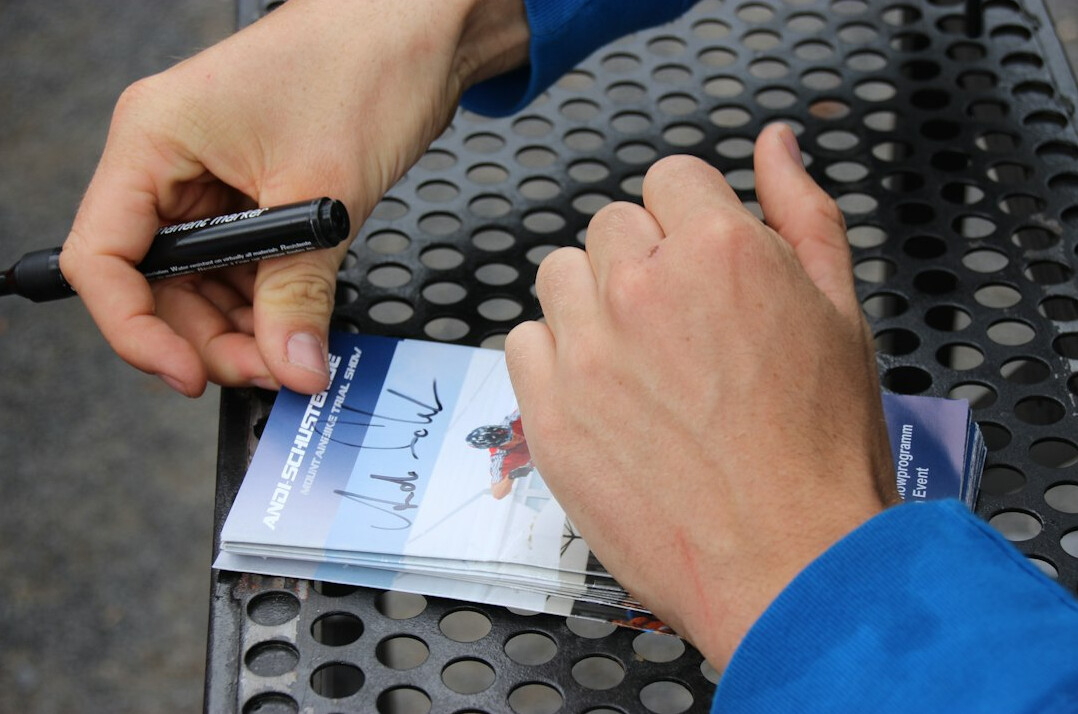 musician signing autograph