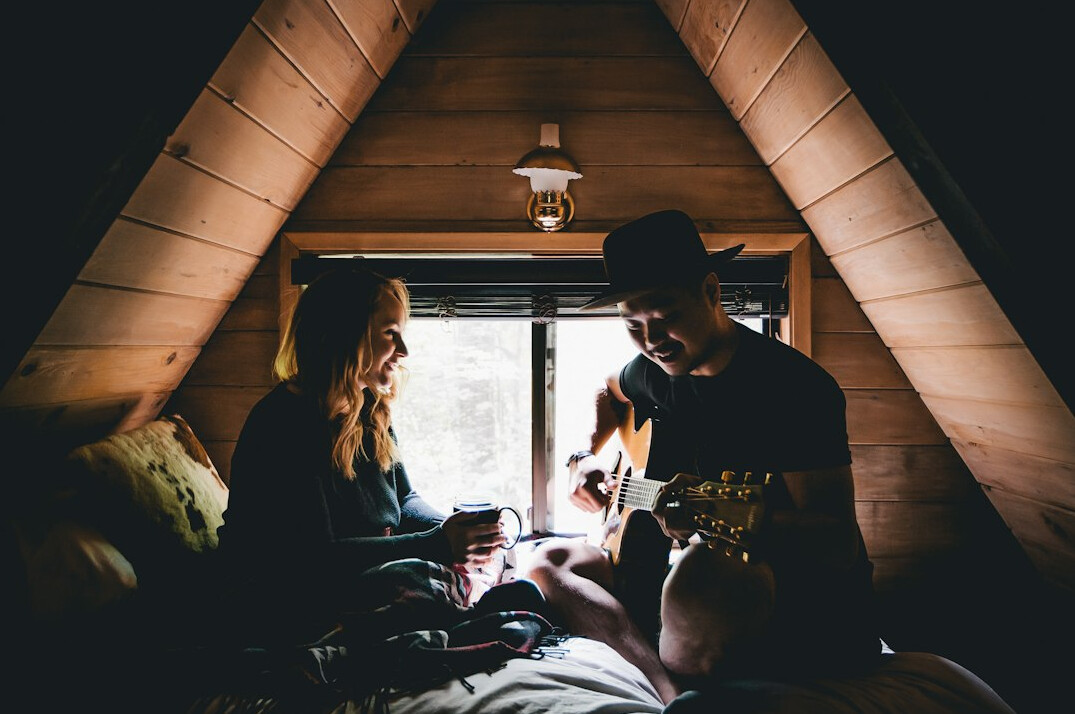 Young Danish couple reviewing paperwork together at home
