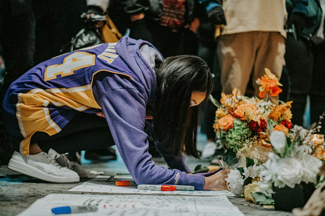 woman signing donation papers